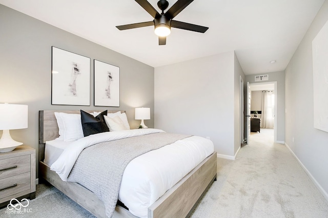 bedroom featuring ceiling fan, baseboards, visible vents, and light carpet