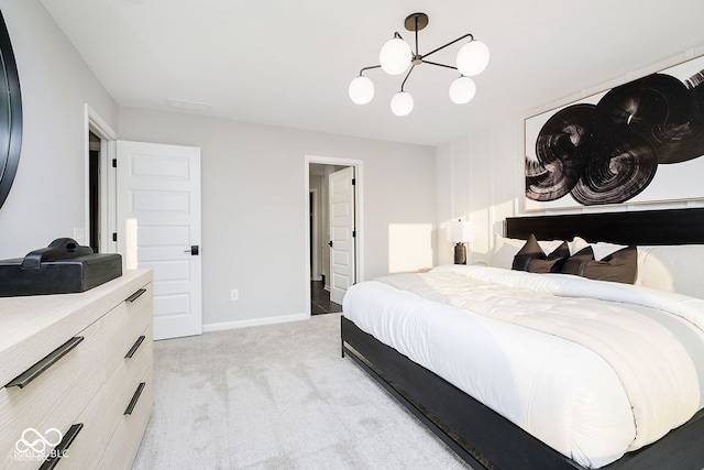 bedroom featuring a notable chandelier, baseboards, and light carpet