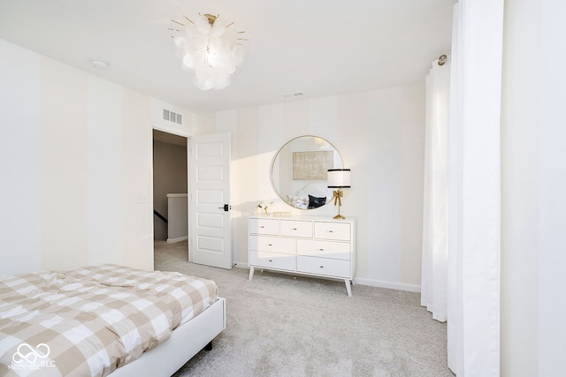 bedroom with visible vents, light carpet, baseboards, and a chandelier