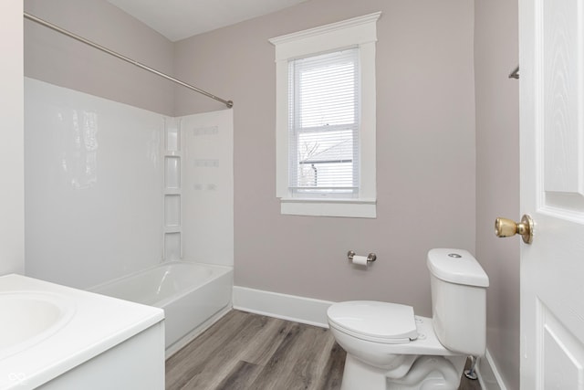 full bathroom featuring vanity, toilet, shower / bath combination, and a wealth of natural light