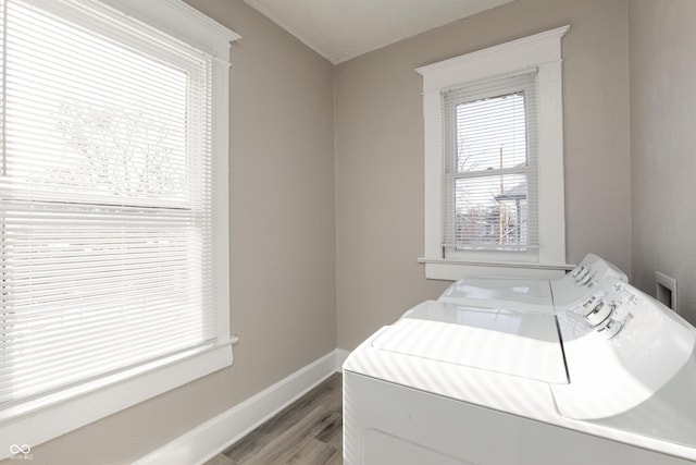 washroom featuring separate washer and dryer, hardwood / wood-style floors, and plenty of natural light