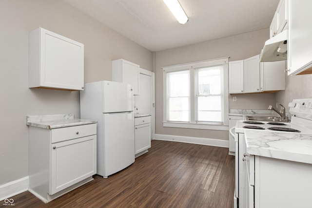 kitchen featuring white cabinetry, light stone countertops, dark hardwood / wood-style floors, and white appliances