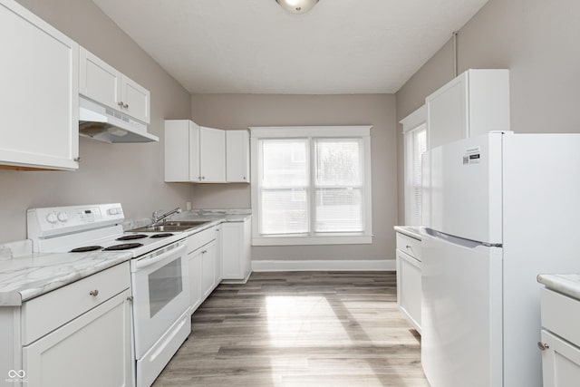 kitchen featuring sink, white cabinets, light stone counters, white appliances, and light hardwood / wood-style flooring