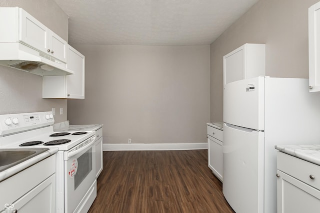 kitchen featuring dark wood-type flooring, light stone counters, a textured ceiling, white appliances, and white cabinets