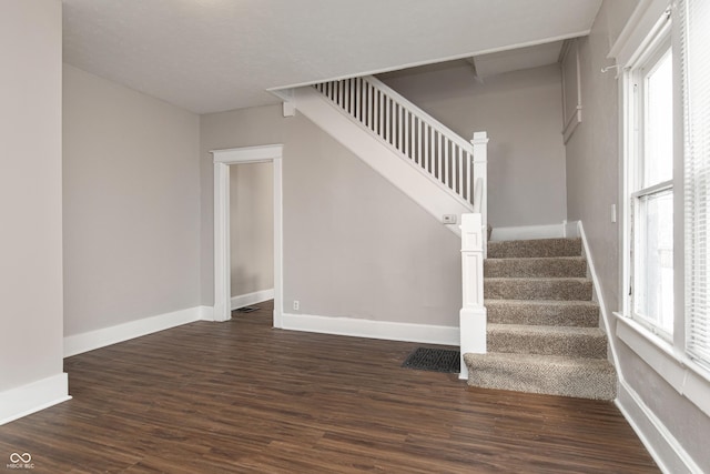 stairway featuring hardwood / wood-style flooring