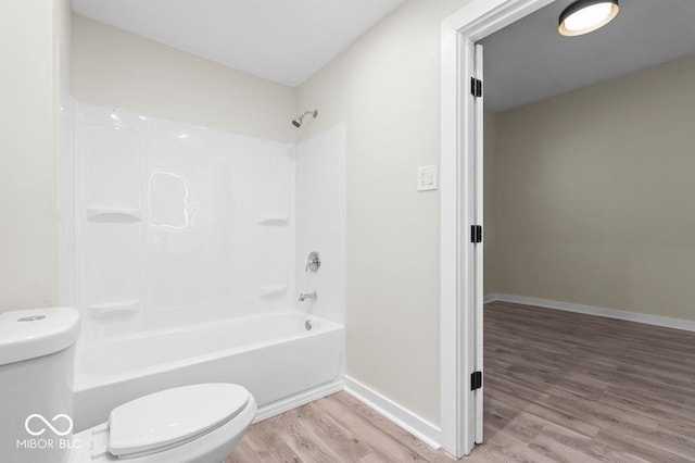 bathroom with wood-type flooring, toilet, and shower / bath combination