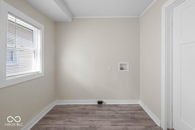 laundry room with hardwood / wood-style floors, ornamental molding, and washer hookup