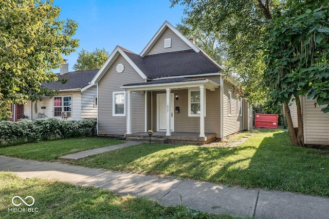 bungalow-style house with a front lawn