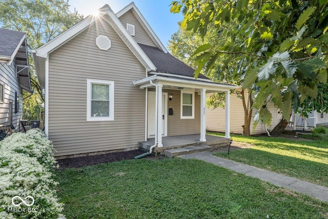 view of front facade with a front lawn and a porch