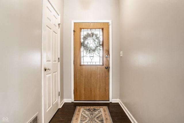 doorway to outside with dark hardwood / wood-style floors