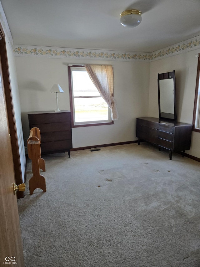 unfurnished bedroom with carpet