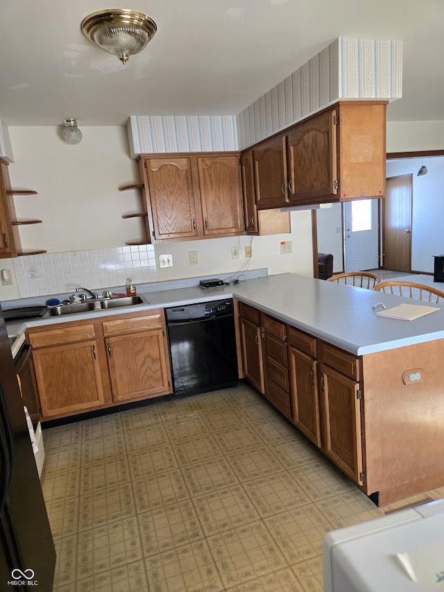 kitchen with dishwasher, sink, and kitchen peninsula