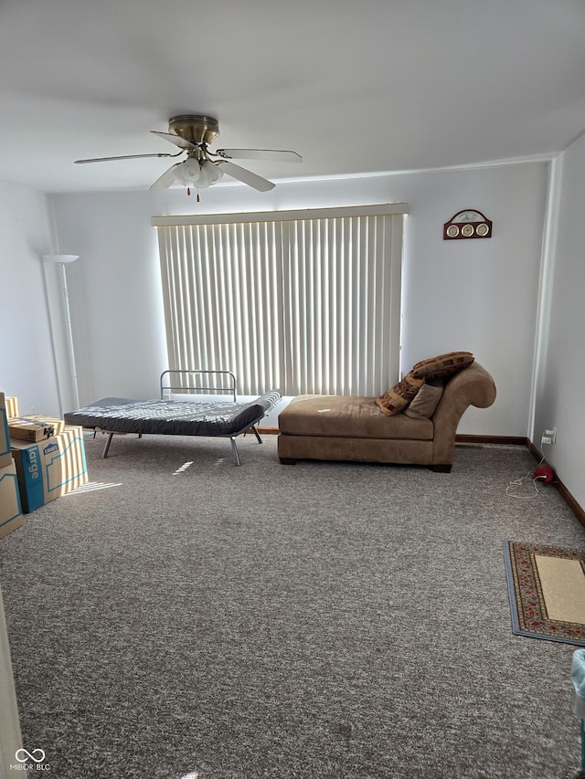 living room with ceiling fan and carpet