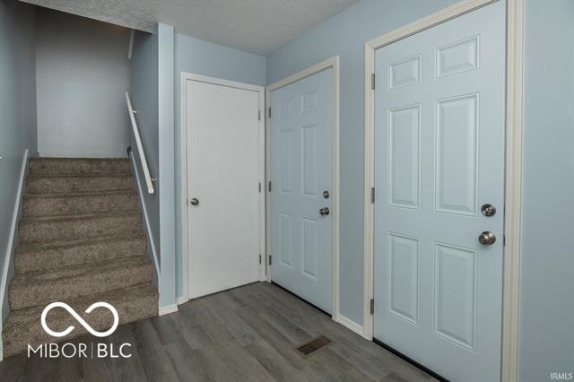 foyer with hardwood / wood-style floors