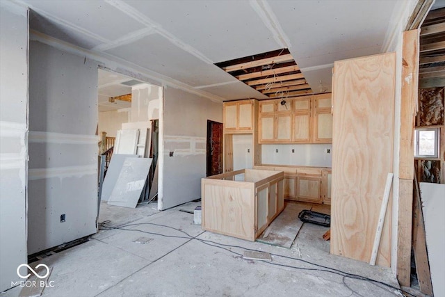 kitchen featuring light brown cabinets