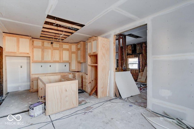 kitchen featuring light brown cabinetry