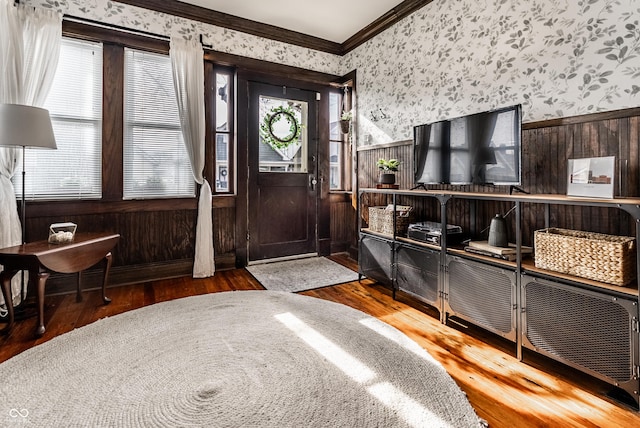 entrance foyer featuring crown molding and hardwood / wood-style floors