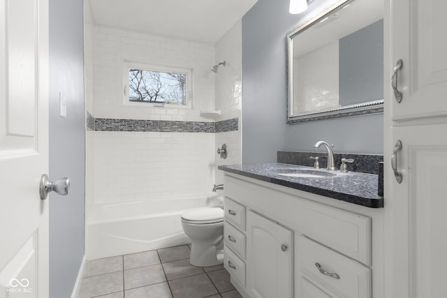 full bathroom with vanity, tiled shower / bath combo, tile patterned floors, and toilet