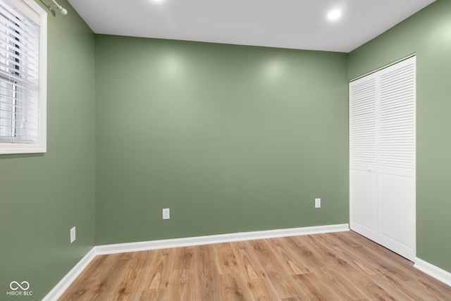 unfurnished room with light hardwood / wood-style floors