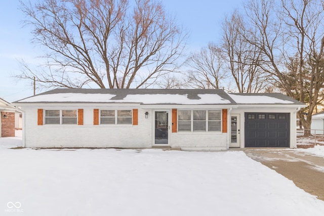 ranch-style home featuring a garage