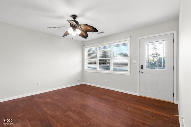 foyer entrance featuring dark wood-type flooring and ceiling fan