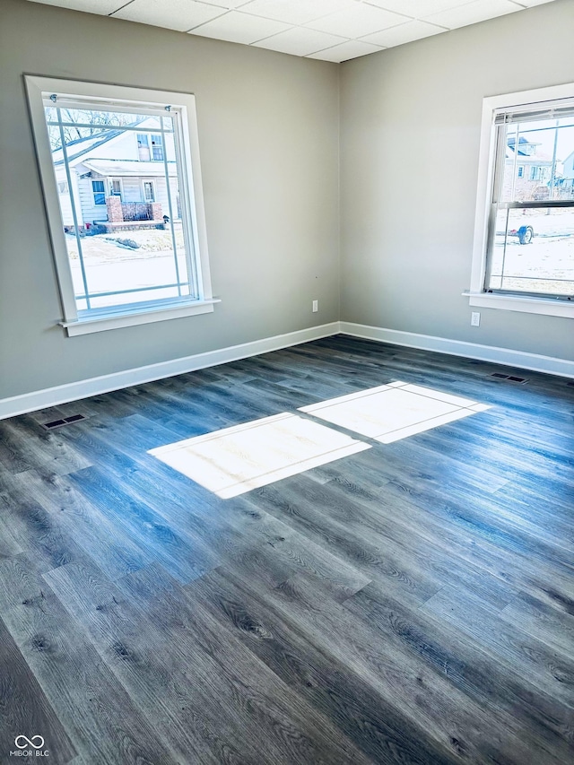 unfurnished room featuring dark wood-type flooring