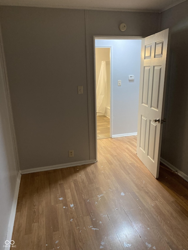 empty room featuring wood-type flooring