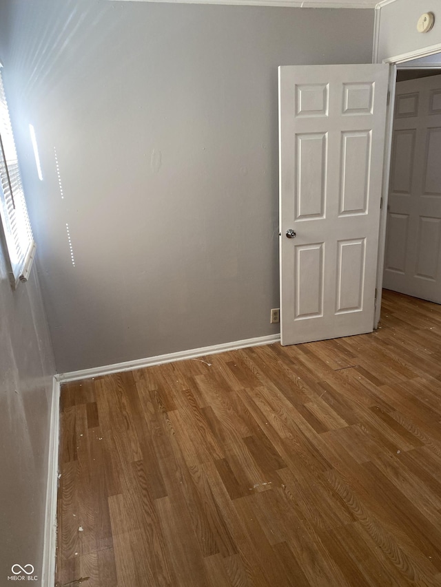 unfurnished bedroom featuring hardwood / wood-style floors
