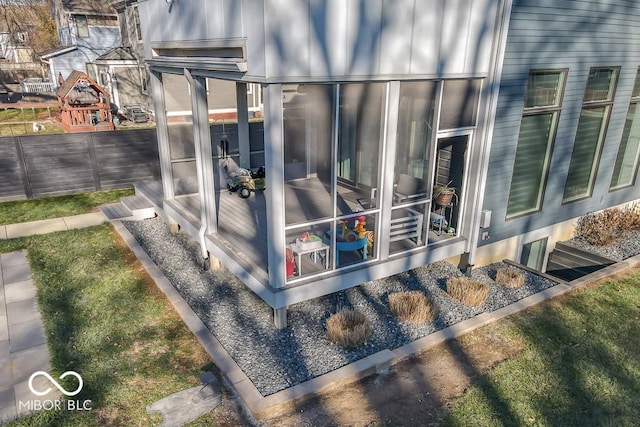 view of side of property with a sunroom