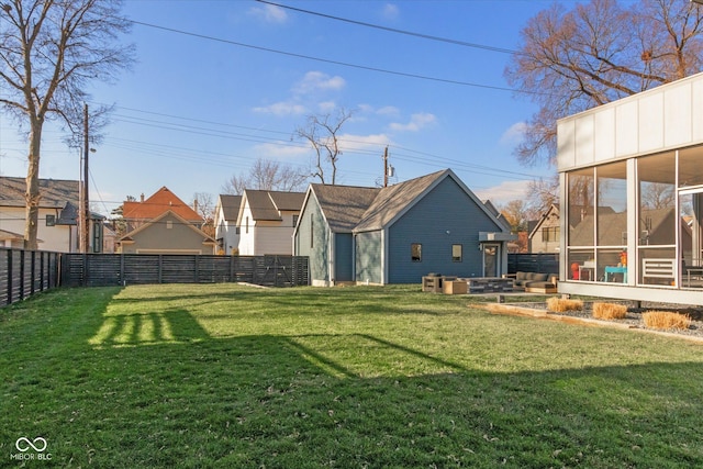 view of yard featuring a sunroom