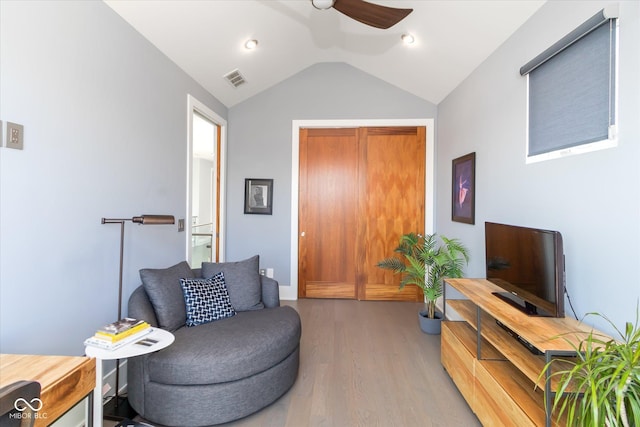 sitting room featuring hardwood / wood-style flooring, ceiling fan, and lofted ceiling