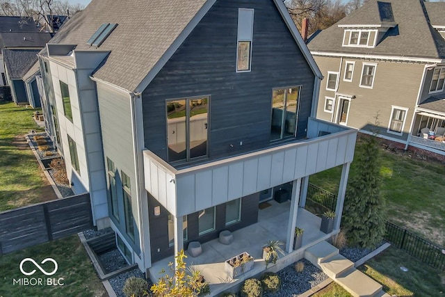 back of property with a patio area and a balcony