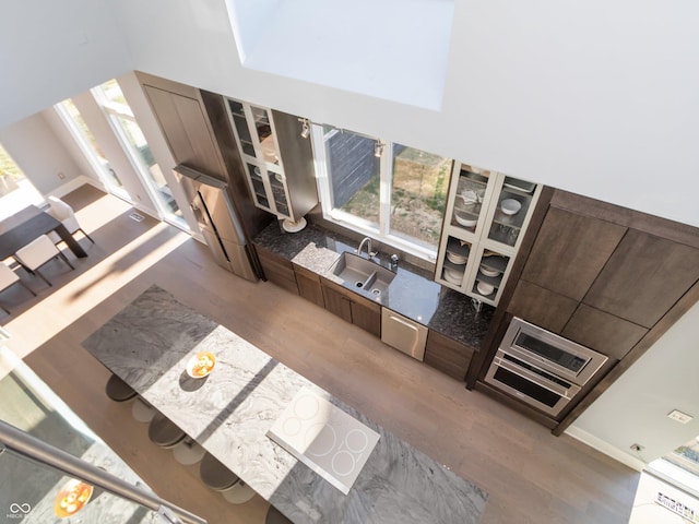 living room featuring wood-type flooring and sink