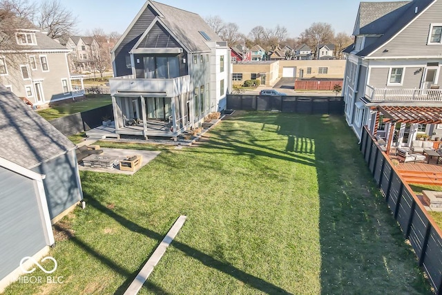 view of yard featuring a pool and a fire pit