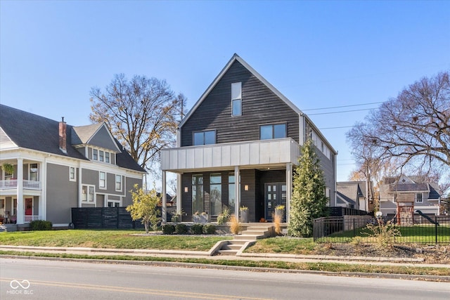 view of front of house with a balcony and a porch