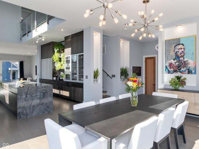 dining space with a notable chandelier and dark wood-type flooring