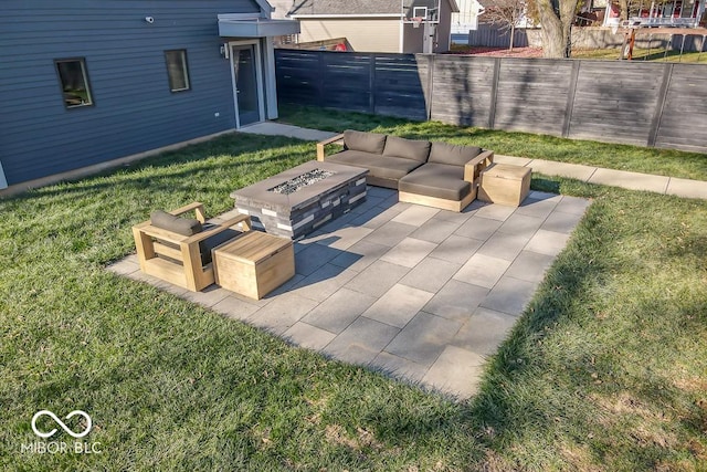 view of patio with an outdoor living space with a fire pit