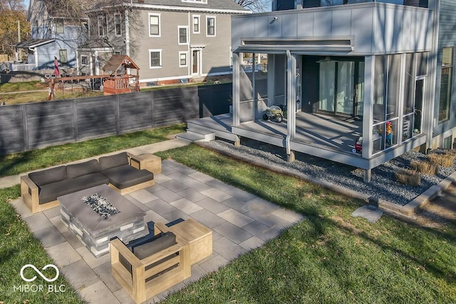 view of patio / terrace featuring an outdoor living space with a fire pit