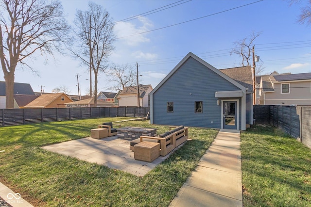 rear view of property with a patio area and a lawn