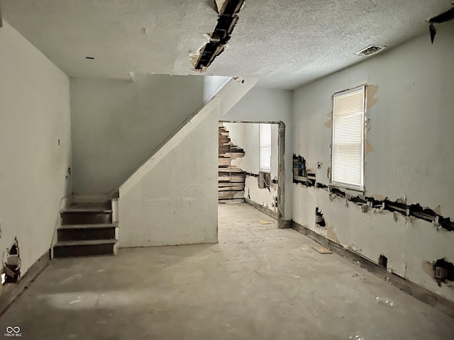 basement with a textured ceiling