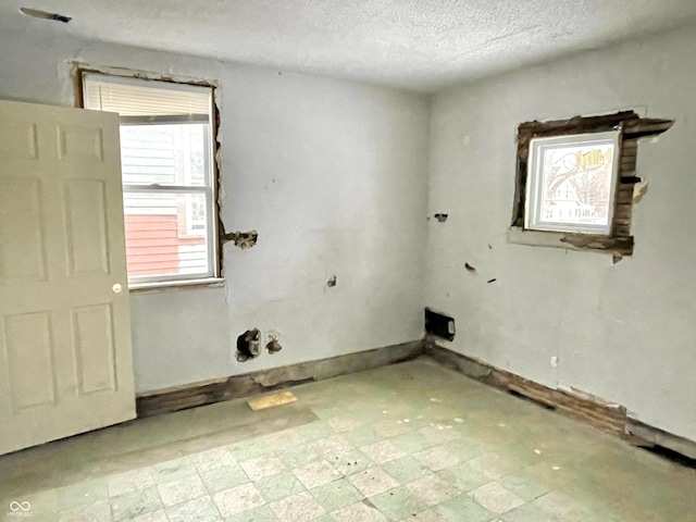 spare room featuring a textured ceiling