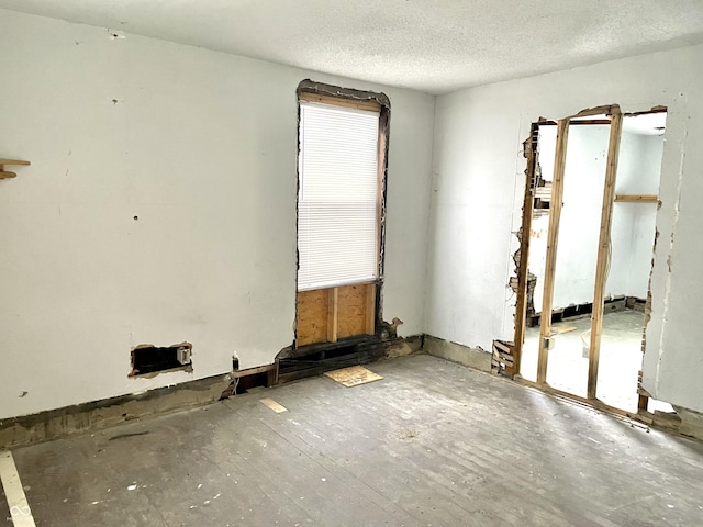 empty room with a textured ceiling