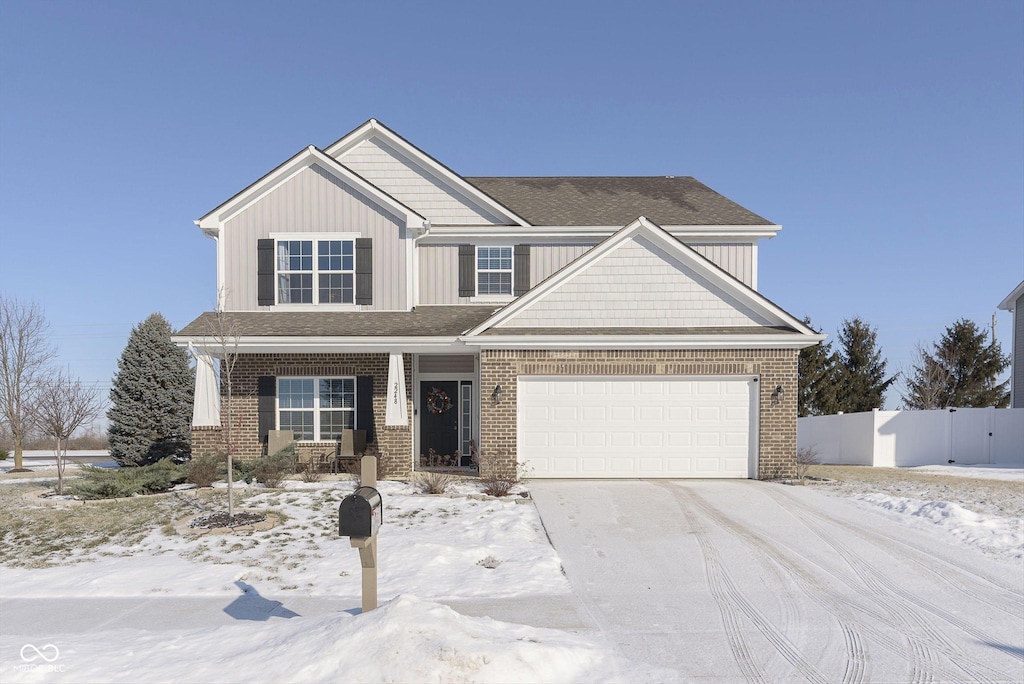 craftsman-style house with a garage and covered porch