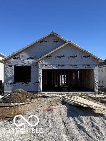 unfinished property with a garage