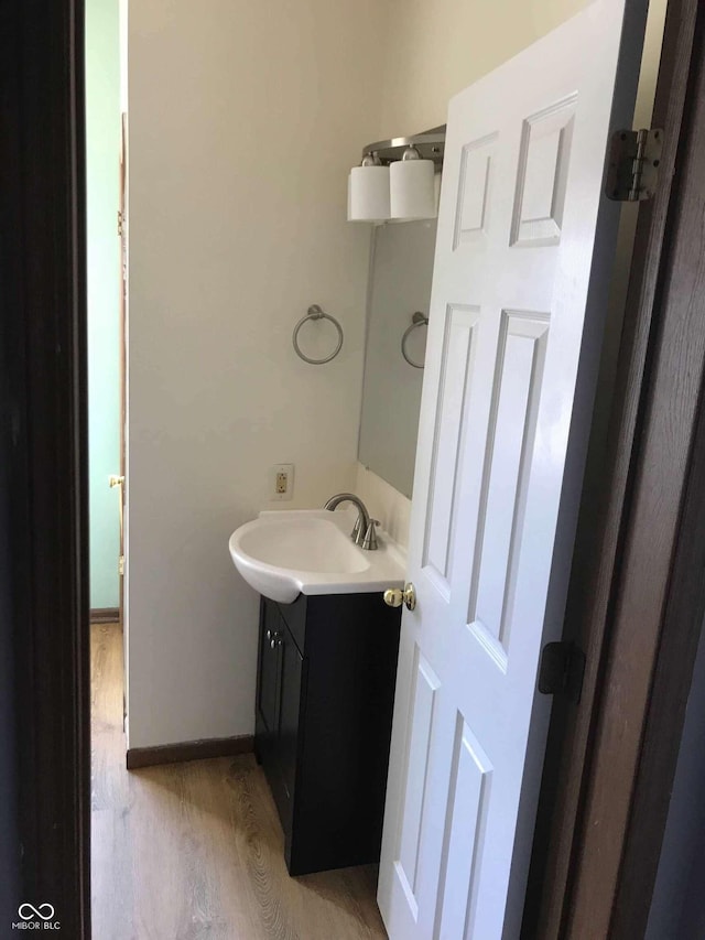 bathroom with vanity and hardwood / wood-style floors