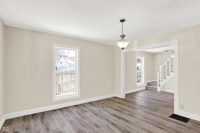 spare room featuring hardwood / wood-style flooring