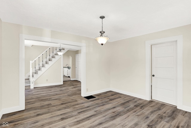 interior space featuring sink and dark hardwood / wood-style flooring