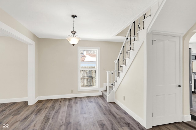 stairs featuring wood-type flooring