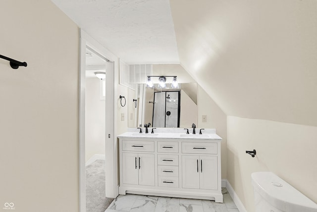 bathroom featuring a shower with door, vanity, a textured ceiling, vaulted ceiling, and toilet