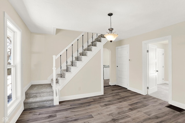 foyer with plenty of natural light and hardwood / wood-style floors